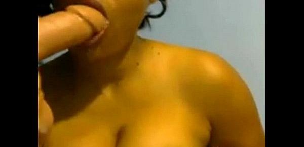  Ebony babe sucks dildo on webcam